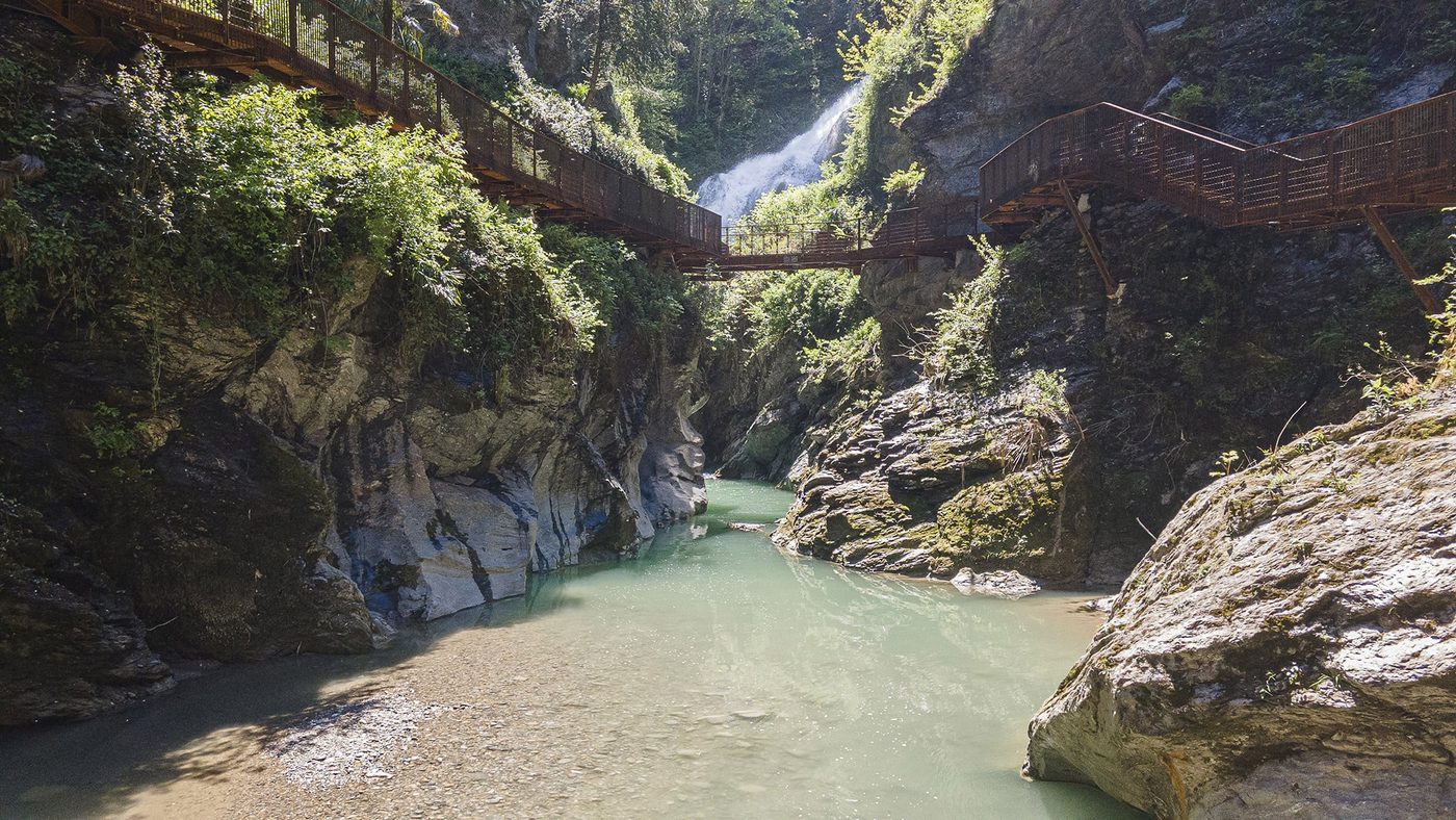 Suspended walkways winding through the Orrido di Bellano gorge above rushing water